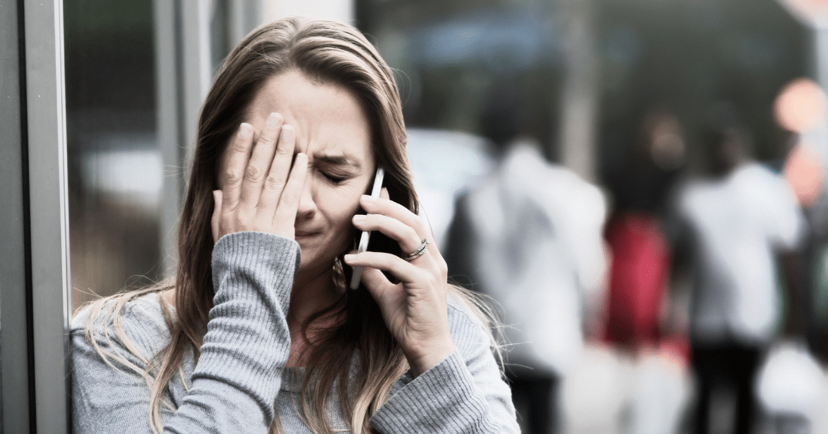 woman distressed on the phone